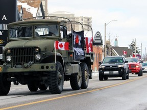 A convoy protesting remaining COVID-19 mandates circles city hall on Saturday, Feb.  26, 2022 in Sarnia, Ont.  Terry Bridge/Sarnia Observer/Postmedia Network