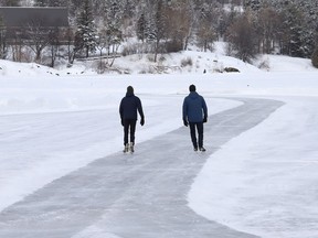 Skaters travel down the Ramsey Lake skating path in Sudbury, Ont. on Tuesday February 8, 2022. John Lappa/Sudbury Star/Postmedia Network