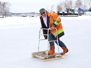 Frank Racicot said he has invented an ice scooter prototype in Sudbury, Ont. He used a wooden pallet with four holes drilled to accommodate a walker, and four skate blades fitted underneath the pallet. Racicot came up with the idea in the fall of 2021. He said his invention is for people who need extra support and want to be safe while on an ice surface. The user can propel the scooter like a land scooter with one boot fitted with ice grips. John Lappa/Sudbury Star/Postmedia Network