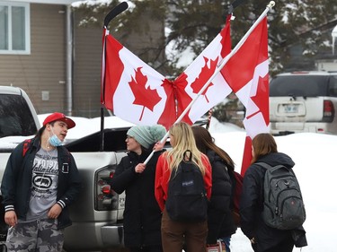 Demonstrators take part in a protest of COVID-19 mandates near the entrance to Lo-Ellen Park Secondary School in Sudbury, Ont. on Friday February 11, 2022. John Lappa/Sudbury Star/Postmedia Network