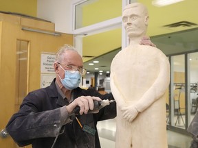 Jim Cook, of the Sudbury Carving Club, works on a wood carving of Father Michael McGivney at the ParkSide Centre in Sudbury, Ont. McGivney is the founder of the Knights of Columbus. John Lappa/Sudbury Star/Postmedia Network