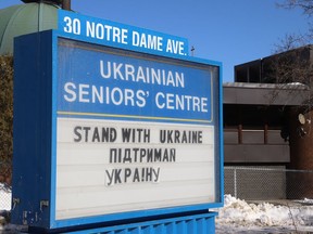 A message to "stand with Ukraine" is displayed at the Ukrainian Seniors' Centre on Notre Dame Avenue on Feb. 25.