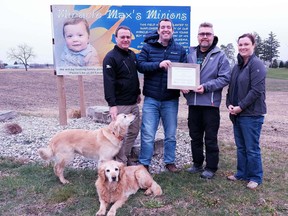 Representatives from the Lambton Soil and Crop Improvement Association and St. Clair Region Conservation Authority presented Plympton-Wyoming farmer Brian Schoonjans with the 2020 Outstanding Farmer Award. From left to right: Parkland Farms' Clark Aitken, Lambton Soil and Crop Improvement Association's Don McGugan, Brian Schoonjans and St. Clair Region Conservation Authority's Donna Blue. Handout/Sarnia This Week