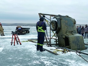 Big Hill Towing and Recovery Service from Cochrane recovered Feb. 15 a jeep that had sitting in Travers Reservoir for two years. A handful of spectators from Little Bow Resort and two Vulcan RCMP members watched a Big Sky crew work to remove the vehicle, which was pulled from the reservoir in the early afternoon. A day earlier, the company had recovered another vehicle, a Ford F-150 truck, that had recently gone through the ice at Travers. (See page 5 for a photograph.) Vulcan RCMP said three vehicles recently fell through the ice at Travers, so two more vehicles are still in the reservoir. The cost for such a recovery is usually between $12,000 and $16,000, said Big Hill. The Alberta government requested that Big Hill remove the jeep, and the province will be billed and then attempt to recoup the funds from the last registered owner, by adding the cost to the renewal of the person's driver's licence. In the case of the truck, an insurance company made the recovery request and will be billed.  STEPHEN TIPPER