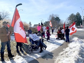 Upwards of 50 people came together in downtown Wallaceburg on Family Day to express their support for the Freedom Convoy and their opposition to vaccine mandates. Peter Epp/Postmedia