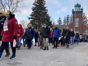Participants with the Coldest Night of the Year fundraiser head out from Old St. Paul's Church Saturday to begin their walk. (Maria Toews/Sentinel-Review)