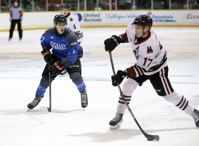 Danny Zhilkin takes a shot as Lorenzo Bonaiuto watches in the second period as the Owen Sound offense hosts the Guelph Storm inside the Harry Lumley Bayshore Community Center on Saturday February 26, 2022. Greg Cowan/The Sun Times