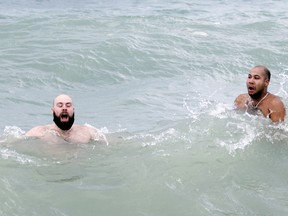 Darren Daye-Trottier (left) and Andre Sampson-Bent both brave the icy Georgian Bay water at Fred Raper Park in Meaford Sunday in support of family members and friends who live nearby to the proposed location of TC Energy's Pumped Storage Hydroelectric Project at the 4th Canadian Division Training Base. The Save Georgian Bay group raised over $20,000 with the polar bear dip. Greg Cowan/The Sun Times