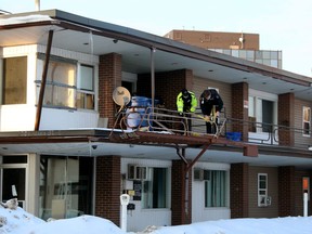 North Bay police officers secure a stairway on Main Street East,, Tuesday. 
PJ Wilson/The Nugget