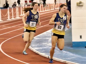Laurentian University's Kristen Mrozewski (60) and Sarah Booth (57) compete in the women's 600-metre race at the York University Winter Open on Friday, February 25, 2022.