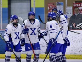 The NAX female prep team celebrates a goal during its 4-1 win over Edge, on February 26. (Northern Alberta Xtreme Academy)