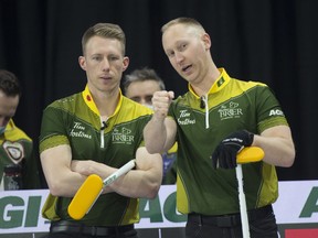 Brad Jacobs of Sault Ste.Marie and 3rd.Marc Kennedy (L) stand at the back of the rings during draw 2 against team Wild Card 3 at the 2022 Tim Hortons Brier in Lethbridge. Team Jacobs opened the round-robin with a 5-3 win over Team Gunnlaugson.