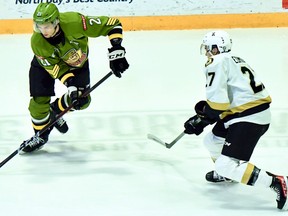 Brandon Coe of the North Bay Battalion goes against Lucas Edmonds of the Kingston Frontenacs in Ontario Hockey League action Sunday. The teams wrapped up their four-game season series.
Sean Ryan Photo