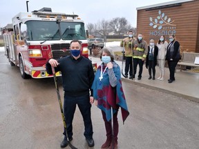 The Stratford Perth Hospice Foundation has announced its first in-person fundraiser since 2019, a charity hockey game featuring a lineup of former pros and members of the Stratford fire department. Pictured in front is Roddy MacDonald, the fire department’s director of fire prevention, and Lucie Stuart, the Stratford Perth Hospice Foundation’s fund development manager. Also pictured is hospice executive director Lana Burchett, co-op student Katie Stevens, and donor relations co-ordinator Mary Nikolakakos. (Chris Montanini/Stratford Beacon Herald)