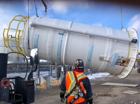 An evaporator module system tank is unloaded at the Origin Materials construction site in Sarnia in this photo provided by the company.