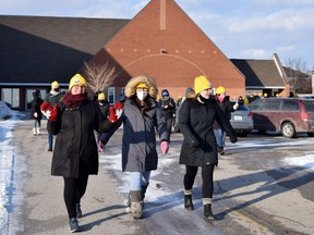 Walkers donned their bright yellow tuques and set off from the Exeter Christian Reformed Church Feb. 26 for the Coldest Night of the Year Exeter fundraiser, which raised nearly $40,000. Dan Rolph