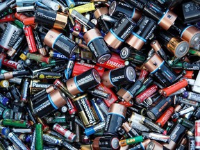 Batteries sit in a collection box at a recycling centre.
File Photo