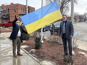 Chatham-Kent chief administrative officer Don Shropshire (left) and Mayor Darrin Canniff, get set to raise the Ukrainian flag at the Civic Centre as a show of solidarity for the Eastern European nation currently under military attack by Russia. Supplied