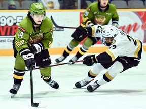 Dalyn Wakely of the host North Bay Battalion competes with fellow rookie Matthew Soto of the Kingston Frontenacs in their Ontario Hockey League game Sunday. The Troops, who won 4-2, visit the Sudbury Wolves twice this weekend.
Sean Ryan Photo