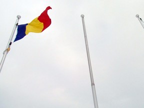 The pole that once flew the Russian flag in front of the Ron Irwin Civic Centre is empty. Left is the flag of Romania and far right is Saudi Arabi’s flag. JEFFREY OUGLER/POSTMEDIA