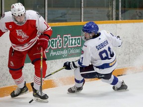 Greater Sudbury Cubs forward Pierson Sobush (91) battles for a puck with Elliot Lake Red Wings defenceman Teegan Dumont (12) during first-period NOJHL action at Gerry McCrory Countryside Sports Complex in Sudbury, Ontario on Thursday, March 10, 2022.