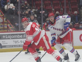 Soo Greyhounds forward Tye Kartye and Kitchener Rangers defenceman Roman Schmidt in first period OHL action at the GFL Memorial Gardens. Kartye chipped in with two power-play goals as the Hounds picked up a 7-4 win over the Rangers on Saturday night.