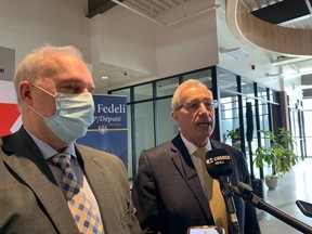 Nipissing MPP Vic Fedeli and Canadore College president George Burton speak to the local media following Tuesday's announcement that will see 160 new long-term care beds built at The Village Community Care Group at Canadore.