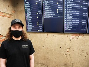Curtis Lemieux, owner of Willy's 420 Supplies in downtown Chatham, is shown in front of the cannabis menu screens at his new location. He previously operated as an accessory business a few doors down before adding cannabis sales. (Tom Morrison/Chatham This Week)