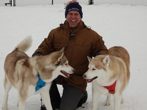 Edward Franko with his two huskies, Karloff and Hitchcock. Photo by Bronson Carver