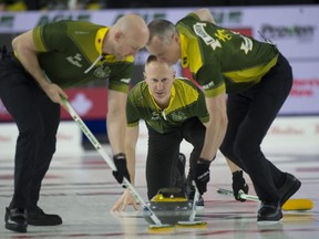 Sault Ste. Marie skip Brad Jacobs delivers his stone to his front end (L-R) lead Ryan Harnden and 2nd E.J. Harnden during draw 4 against Team B.C. at the 2022 Tim Hortons Brier in Lethbridge, Alta.