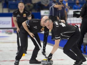 Skip Brad Jacobs follows his front end (L) lead Ryan Harnden, 2nd. E.J.Harnden, during draw 8 against team Gushue at the Canadian Curling Trials in Saskatoon back in November.