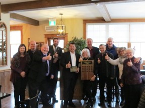 Walker House owners Robert Ho and Mary Putnam (centre) celebrated after receiving the 2021 Saugeen Shores Muncipal Heritage award for maintaining the heritage and historic value of Southampton landmark. [Supplied]