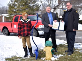 From left are Harrison Geoffrey, Mayor George Finch and fire chief Jeremy Becker as Geoffrey is presented with a Mayor’s Commendation March 14. Dan Rolph