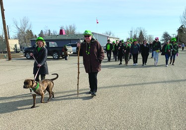 Carmangay's annual St. Patrick's Day parade attracted a large crowd Thursday. This year's one-block walk was a bitter-sweet one for local residents after the Grange Hotel, where the parade ends, burned to the ground on March 28, 2021. The parade ended on the sidewalk by the now vacant lot where the hotel, built in 1909, used to sit. A few words were said there in remembrance of the hotel, where people used to celebrate St. Patrick's Day after the parade. After last Thursday's parade, Irish stew was served at the Carmangay Curling Club and Irish songs were performed.