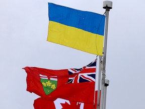 The Ukrainian flag flies over the Ontario and Canadian flags behind Brockville City Hall. (FILE PHOTO)