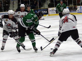 Ryan Botterill trying to break through Logan Rands in Saturday's loss. The Terriers were eliminated from a shot at the playoffs with the loss. (supplied photo)