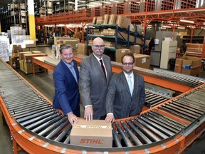 At Stihl's packeage sorting area, from left, is Clark Grue, CEP Rainmaker Global Market Access, Malcolm Bruce, CEO Edmonton Global and Myron Keehn, Edmonton International Airport, VP Air Services and Business Development as Port Alberta held a relaunched to further develop and promote the Edmonton Metropolitan Region as an inland port, focusing on attracting foreign investment and helping regional businesses trade with the world, at Stihl distribution centre in Acheson west of Edmonton, March 23. Ed Kaiser/Postmedia