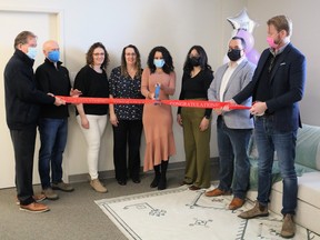 Psychotherapist Kaitlin Senkus,centre, cuts the ribbon at the opening ceremonies of Creating Connection's new expanded office upstairs at 192 Third Ave. The facility offers a wide variety of services including family and couples therapy and mental health assistance. Also taking part in the ribbon cutting were, from left, Mayor George Pirie, Downtown Timmins BIA President Jamie Roach, social workers Julie Joanisse-Gillis and Huguette Ladouceur, psychotherapist Amira Delorme, Coun. Cory Robin, and Cameron Grant of the Timmins Chamber. 

ANDREW AUTIO/The Daily Press