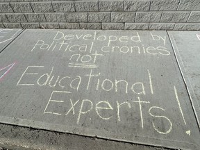 A small chalk protest, called Chalk the Walk, hit the sidewalks outside of the constituency offices belonging to local MLAs Nate Glubish and Jordan Walker on Friday morning, March 25. Photo Supplied