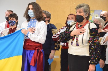 Members of the local Ukrainian community, including Halia Buba, at right, take part in a service for peace held by the Sudbury Interfaith Dialogue at the Parkside Centre on Sunday afternoon.