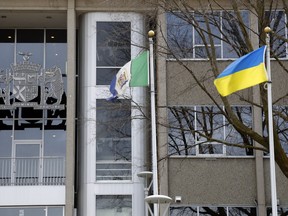 The flags of Hastings County, centre, and Ukraine, right, fly outside the county's main office building in Belleville. Wednesday's council meeting, which included approval of the 2022 operating and capital budgets, began with the playing of the Ukrainian national anthem and a message of support from Warden Rick Phillips in support of Ukraine.