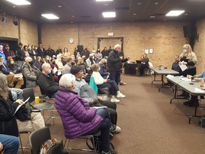 During Tuesday's public meeting in Studio One of the Cultural Centre, residents ask questions about the homeless shelter planned for the former Victoria Park public school building, located at 185 Murray St. in Chatham. (Trevor Terfloth/The Daily News)