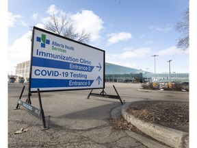 A sign points the way to the Immunization Clinic and Testing Centre at the Edmonton Expo Centre. Photo by Postmedia, file.