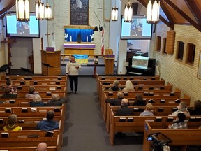 Reverend Greg Kjos speaks on his time in Ukraine during a fundraiser for Ukrainian relief efforts, at St. Peter's Lutheran Church, March 24. (Susan Perry)