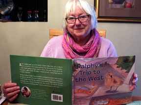 Marianne Bartsch shows off the cover to her book, Ralphy's Trip to the West.
PJ Wilson/The Nugget