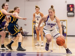Laurier Golden Hawks’ Cassidy Hirtle, right, plays against the Windsor Lancers in an OUA women’s basketball game in Waterloo, Ont., on Saturday, Nov. 27, 2021. (Christian Bender/Wilfrid Laurier Golden Hawks)