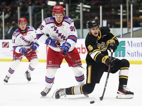 Sarnia Sting's Marko Sikic (15) scores while being chased by Kitchener Rangers' Justin Nolet (95) in the first period at Progressive Auto Sales Arena in Sarnia, Ont., on Sunday, March 6, 2022. Mark Malone/Chatham Daily News/Postmedia Network