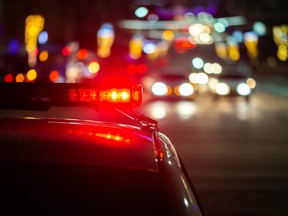 police car lights in night city with selective focus and bokeh