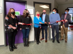 Fort Saskatchewan Mayor Gale Katchur cuts the ribbon at the BGC alongside United Way President Rob Yager and members of the United Way Heartland Challenge. Photo supplied.