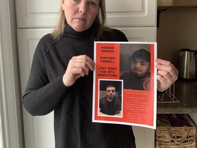 Emma Morrison with a poster of her son Brayden Ferrall who has been missing for more than a month